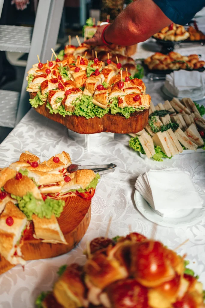 A generous display of small sandwiches at a gathering