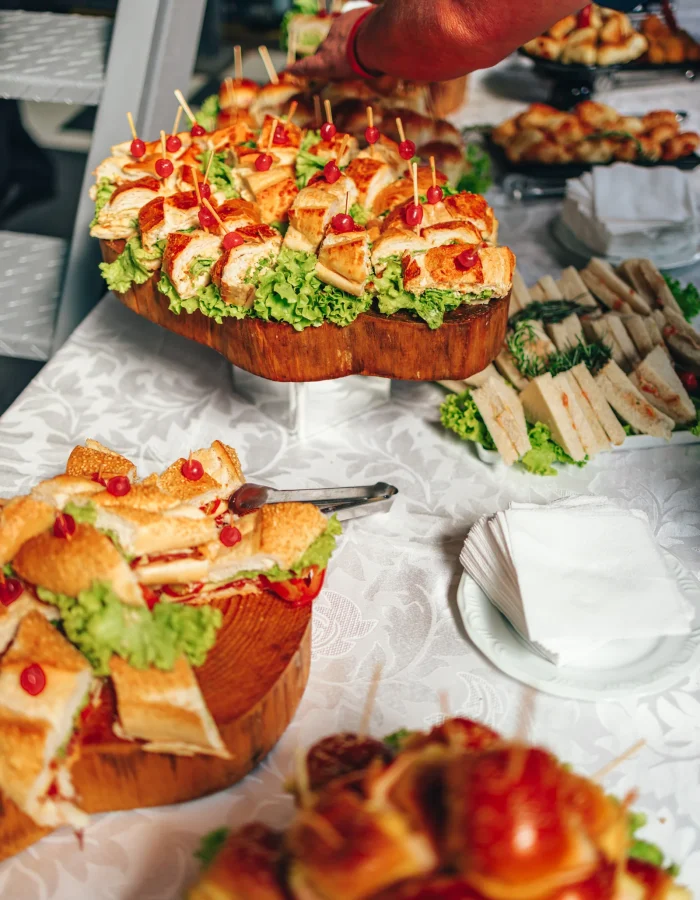A generous display of small sandwiches at a gathering